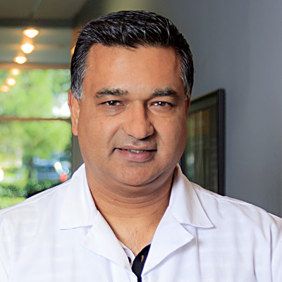 headshot of Dr. ManjSandhu