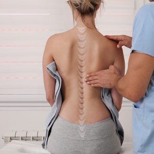 woman getting back examined