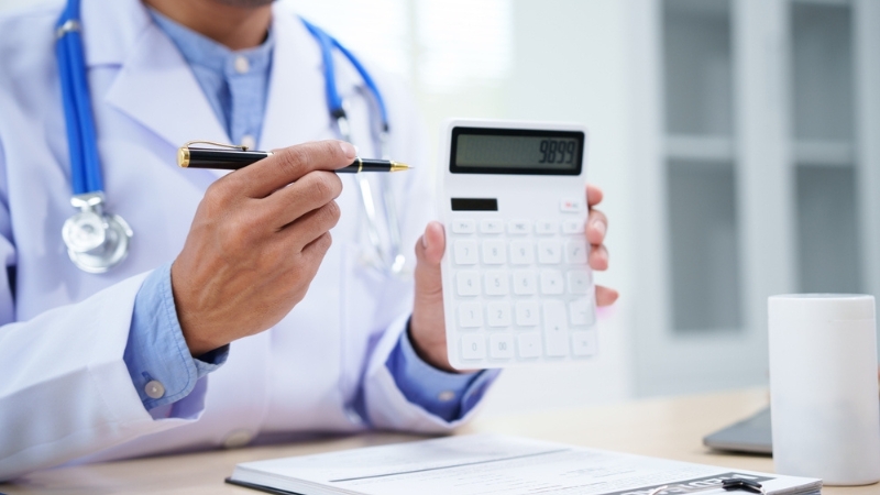 A chiropractor explains treatment options and outlines visit costs to help patients plan their care with confidence.