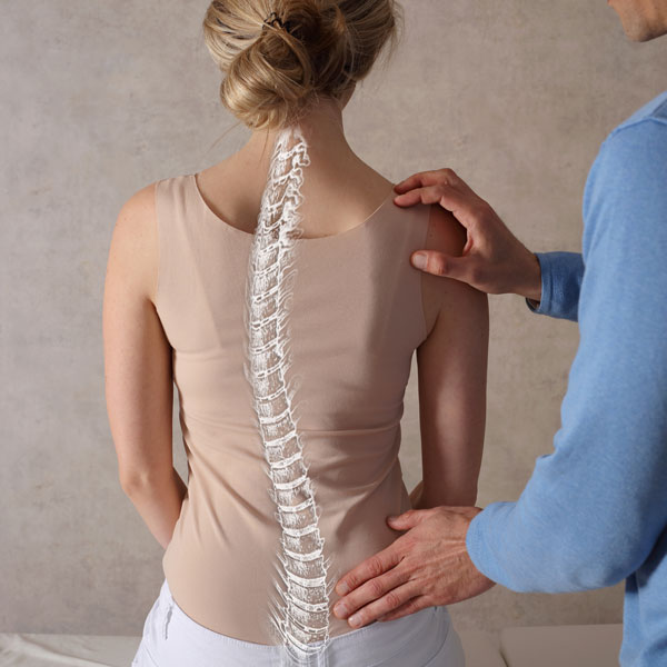 A chiropractor provides non-invasive scoliosis treatment to help patients improve spinal alignment and reduce discomfort.
